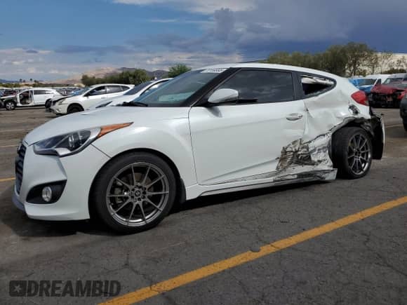 2014 Hyundai Veloster Turbo R-Spec с VIN KMHTC6AE1EU208532, выставлен на аукционе Copart как лот 70159995 с пробегом 75 844 миль миль и Списание • Salvage title. История ставок и продаж доступна на DreamBid. Изображение 1.