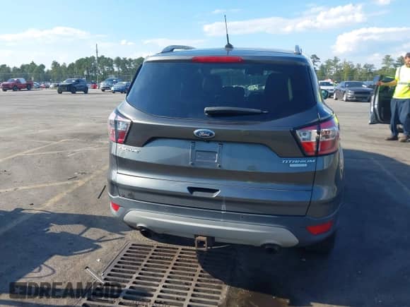 2017 Ford Escape Titanium with VIN 1FMCU0J92HUE56774, listed as a IAAI auction lot 43255074 with 107,556 mi miles and . Bid and sale history available at DreamBid. Image 17.