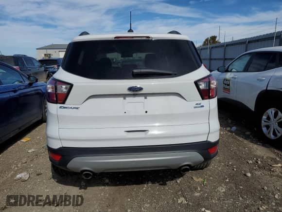 2018 Ford Escape SE с VIN 1FMCU9GD1JUB06459, выставлен на аукционе Copart как лот 84913405 с пробегом 101 457 миль миль и Чистый • Clean title. История ставок и продаж доступна на DreamBid. Изображение 6.