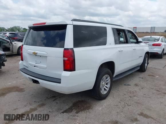 2017 Chevrolet Suburban LT with VIN 1GNSCHKC7HR115215, listed as a IAAI auction lot 42140471 with 153,705 mi miles and . Bid and sale history available at DreamBid. Image 4.
