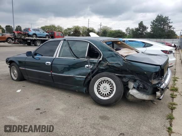 1998 BMW 7 Series 740iL with VIN WBAGJ8329WDM24296, listed as a Copart auction lot 73581634 with 247,498 mi miles and Salvage title. Bid and sale history available at DreamBid. Image 2.