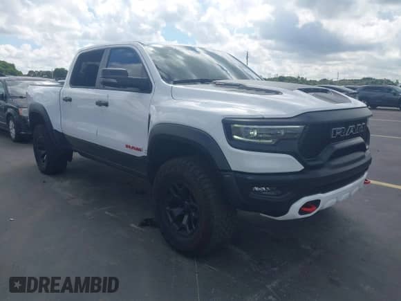 2023 Ram 1500 TRX z VIN 1C6SRFU95PN572888, wystawiony jako IAAI lot #43319141 z przebiegiem 17 078 mil mil oraz . Historia ofert i sprzedaży dostępna na DreamBid. Obrazek 1.