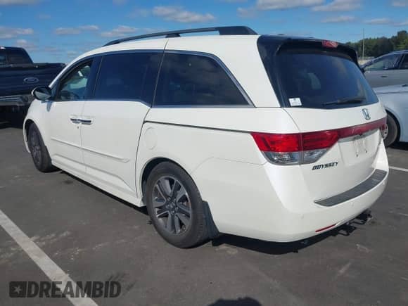 2016 Honda Odyssey Touring Elite z VIN 5FNRL5H9XGB047482, wystawiony jako IAAI lot #43439998 z przebiegiem 184 606 mil mil oraz . Historia ofert i sprzedaży dostępna na DreamBid. Obrazek 3.