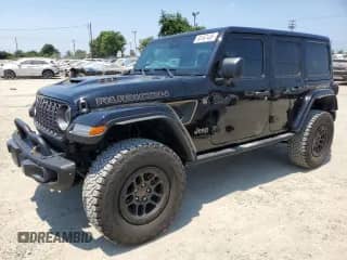 2023 Jeep Wrangler Rubicon 20th Anniversary с VIN 1C4JJXSJ0PW694745, выставлен на аукционе Copart как лот 65167435 с пробегом 20 950 миль миль и Списание • Salvage title. История ставок и продаж доступна на DreamBid. Изображение 1.