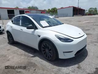 2022 Tesla Model Y Performance with VIN 7SAYGDEFXNF446588, listed as a IAAI auction lot 42827811 with 54,185 mi miles and . Bid and sale history available at DreamBid. Image 1.