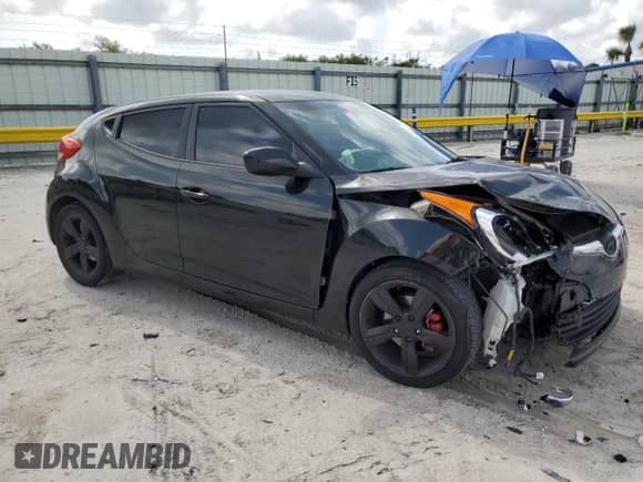 2014 Hyundai Veloster z VIN KMHTC6AD3EU196343, wystawiony jako Copart lot #59891375 z przebiegiem 127 594 mil mil oraz Szkoda całkowita • Salvage title. Historia ofert i sprzedaży dostępna na DreamBid. Obrazek 4.