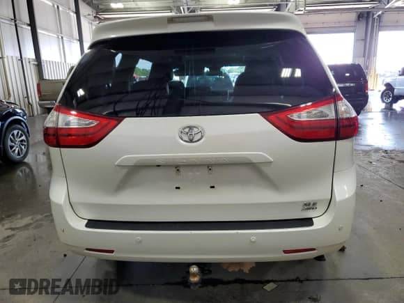 2017 Toyota Sienna XLE with VIN 5TDDZ3DC9HS187728, listed as a Copart auction lot 63786565 with 104,233 mi miles and Salvage title. Bid and sale history available at DreamBid. Image 6.