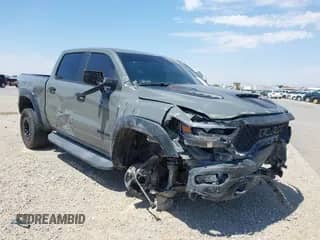 2023 Ram 1500 TRX with VIN 1C6SRFU98PN695570, listed as a IAAI auction lot 42842891 with 12,495 mi miles and . Bid and sale history available at DreamBid. Image 1.