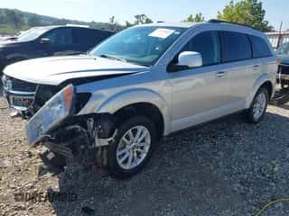2014 Dodge Journey SXT with VIN 3C4PDCBB3ET112742, listed as a IAAI auction lot 43420445 with 113,538 mi miles and . Bid and sale history available at DreamBid. Image 2.