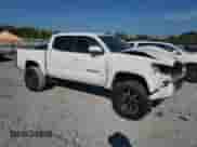 2021 Toyota Tacoma SR5 with VIN 3TYAZ5CN6MT005354, listed as a Copart auction lot 70816115 with 144,733 mi miles and Salvage title. Bid and sale history available at DreamBid. Image 4.
