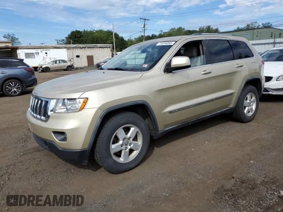 2011 Jeep Grand Cherokee 70th Anniversary with VIN 1J4RR4GGXBC563334, listed as a Copart auction lot 71876355 with 104,989 mi miles and Clean title. Bid and sale history available at DreamBid. Image 1.