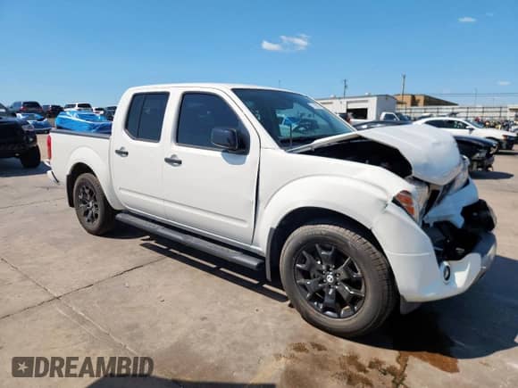 2021 Nissan Frontier SV with VIN 1N6ED0EA7MN723443, listed as a Copart auction lot 71290275 with 57,013 mi miles and Salvage title. Bid and sale history available at DreamBid. Image 4.