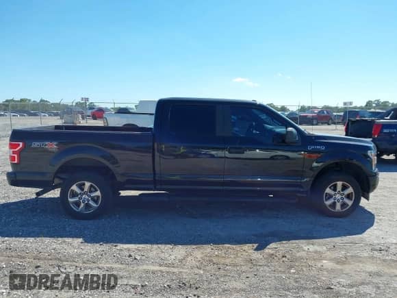 2019 Ford F-150 Lariat with VIN 1FTFW1E41KFD28179, listed as a IAAI auction lot 43460411 with 185,554 mi miles and . Bid and sale history available at DreamBid. Image 13.