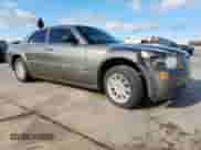 2009 Chrysler 300 LX with VIN 2C3LA43D49H641732, listed as a Copart auction lot 81342015 with 148,830 mi miles and Salvage title. Bid and sale history available at DreamBid. Image 4.