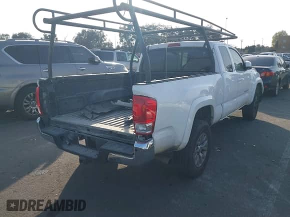 2018 Toyota Tacoma SR5 with VIN 5TFRZ5CN3JX064821, listed as a IAAI auction lot 41478807 with 106,495 mi miles and . Bid and sale history available at DreamBid. Image 4.