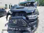 2021 Toyota Tacoma SR5 z VIN 3TYDZ5BN1MT002778, wystawiony jako IAAI lot #42591088 z przebiegiem Nie podano mil oraz . Historia ofert i sprzedaży dostępna na DreamBid. Obrazek 12.
