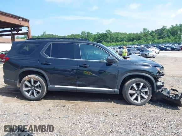 2024 Honda Pilot Touring with VIN 5FNYG1H77RB024994, listed as a IAAI auction lot 42672752 with 23,740 mi miles and . Bid and sale history available at DreamBid. Image 13.