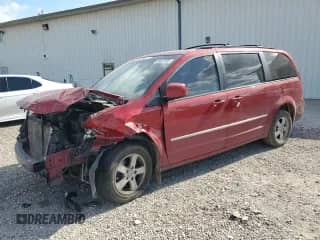 2010 Dodge Grand Caravan SXT with VIN 2D4RN5DX5AR125907, listed as a Copart auction lot 69637335 with 211,789 mi miles and Salvage title. Bid and sale history available at DreamBid. Image 1.