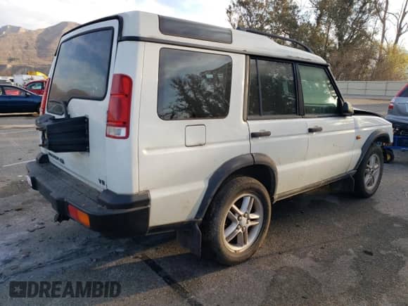 2000 Land Rover Discovery Cloth with VIN SALTY1543YA273374, listed as a Copart auction lot 86026964 with 115,114 mi miles and Clean title. Bid and sale history available at DreamBid. Image 3.