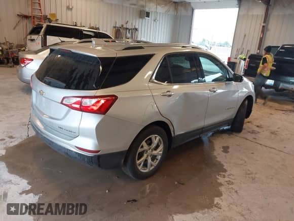 2021 Chevrolet Equinox Premier z VIN 3GNAXXEV8MS109583, wystawiony jako IAAI lot #43122552 z przebiegiem 88 070 mil mil oraz . Historia ofert i sprzedaży dostępna na DreamBid. Obrazek 4.