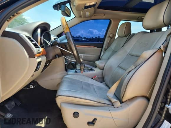 2012 Jeep Grand Cherokee Overland with VIN 1C4RJFCT9CC346497, listed as a Copart auction lot 63004635 with 142,623 mi miles and Salvage title. Bid and sale history available at DreamBid. Image 7.