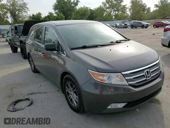 2013 Honda Odyssey EX-L с VIN 5FNRL5H65DB065311, выставлен на аукционе Copart как лот 81468745 с пробегом 188 718 миль миль и Списание • Salvage title. История ставок и продаж доступна на DreamBid. Изображение 14.