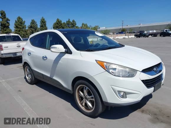 2012 Hyundai Tucson GLS with VIN KM8JU3AC9CU369869, listed as a IAAI auction lot 41997827 with 148,728 mi miles and . Bid and sale history available at DreamBid. Image 6.
