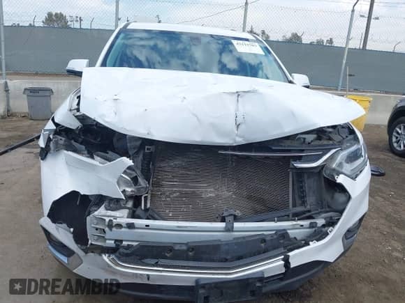 2018 Chevrolet Traverse LT Cloth z VIN 1GNEVGKW5JJ264075, wystawiony jako IAAI lot #43115703 z przebiegiem 121 358 mil mil oraz . Historia ofert i sprzedaży dostępna na DreamBid. Obrazek 6.