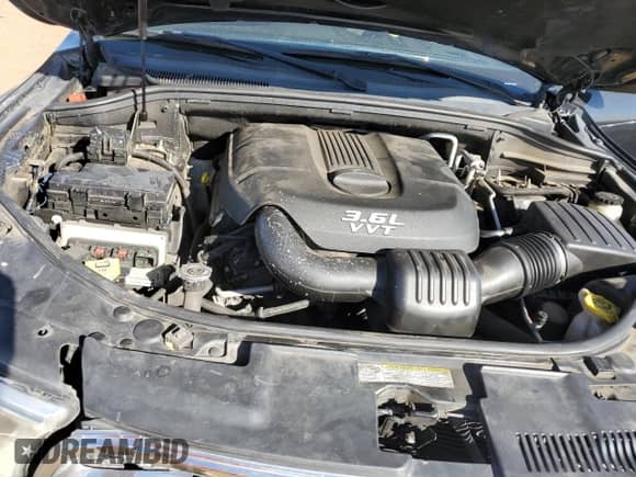 2012 Dodge Durango SXT with VIN 1C4RDHAG5CC335702, listed as a Copart auction lot 69629393 with 141,138 mi miles and Salvage title. Bid and sale history available at DreamBid. Image 13.
