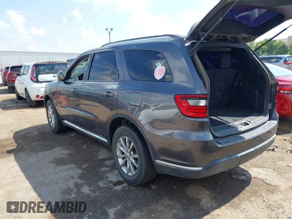 2016 Dodge Durango SXT with VIN 1C4RDJAG5GC393418, listed as a IAAI auction lot 43206789 with 153,703 mi miles and . Bid and sale history available at DreamBid. Image 3.