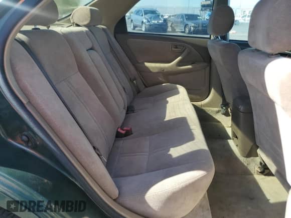 1999 Toyota Camry LE z VIN JT2BG28KXX0359137, wystawiony jako Copart lot #85011045 z przebiegiem 158 951 mil mil oraz Czysty tytuł • Clean title. Historia ofert i sprzedaży dostępna na DreamBid. Obrazek 10.