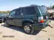 1998 Jeep Grand Cherokee with VIN 1J4FX48S8WC281615, listed as a Copart auction lot 77305594 with 128,393 mi miles and Salvage title. Bid and sale history available at DreamBid. Image 2.