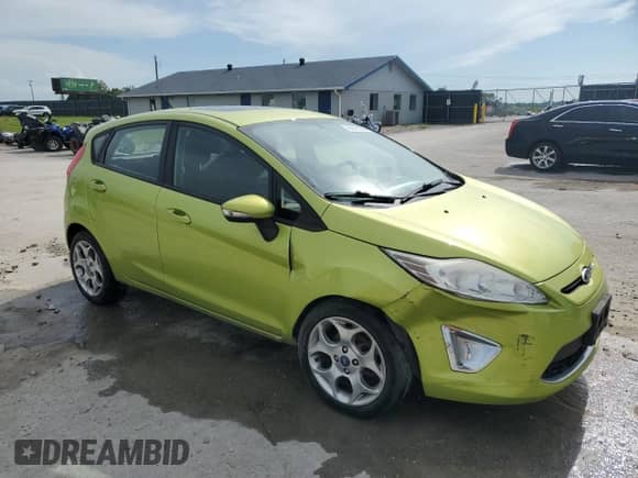 2012 Ford Fiesta SES with VIN 3FADP4FJ6CM117710, listed as a Copart auction lot 64371335 with 92,029 mi miles and Salvage title. Bid and sale history available at DreamBid. Image 4.
