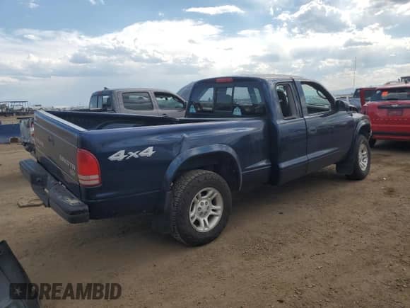 2004 Dodge Dakota z VIN 1D7HG12K24S677070, wystawiony jako Copart lot #60228055 z przebiegiem 176 990 mil mil oraz Szkoda całkowita • Salvage title. Historia ofert i sprzedaży dostępna na DreamBid. Obrazek 3.