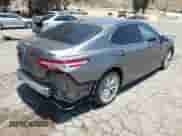 2020 Toyota Camry Hybrid XLE with VIN 4T1F31AK0LU527228, listed as a IAAI auction lot 42532828 with 99,749 mi miles and . Bid and sale history available at DreamBid. Image 4.