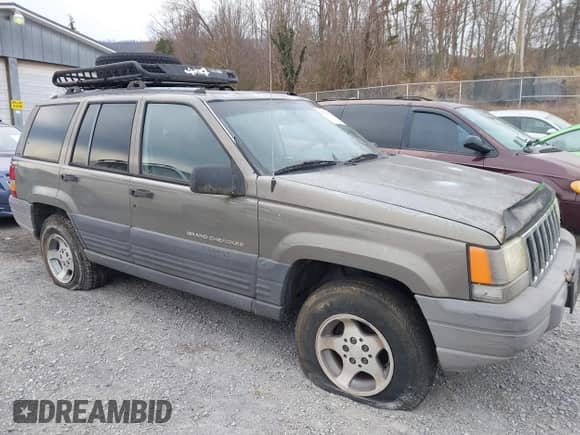 1996 Jeep Grand Cherokee with VIN 1J4EZ58S1TC112995, listed as a IAAI auction lot 41706966 with 356,727 mi miles and . Bid and sale history available at DreamBid. Image 6.
