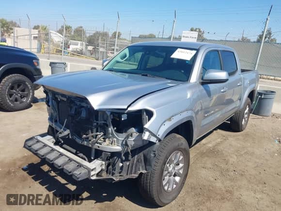 2018 Toyota Tacoma SR5 with VIN 5TFAZ5CN8JX054363, listed as a IAAI auction lot 43012474 with 138,074 mi miles and . Bid and sale history available at DreamBid. Image 2.