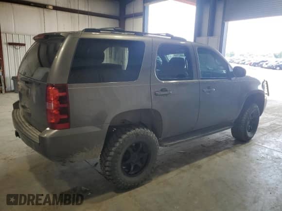 2011 Chevrolet Tahoe LT with VIN 1GNSKBE02BR317176, listed as a Copart auction lot 59671175 with 180,216 mi miles and Salvage title. Bid and sale history available at DreamBid. Image 3.