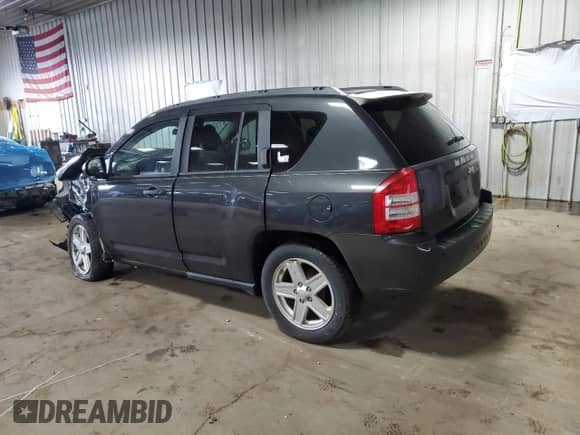 2010 Jeep Compass Sport z VIN 1J4NT1FB3AD647153, wystawiony jako Copart lot #61261595 z przebiegiem Nie podano mil oraz Nie do naprawy • Non repairable. Historia ofert i sprzedaży dostępna na DreamBid. Obrazek 2.