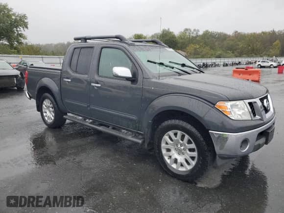 2010 Nissan Frontier LE with VIN 1N6AD0EV0AC419279, listed as a Copart auction lot 82463385 with 83,722 mi miles and Salvage title. Bid and sale history available at DreamBid. Image 4.