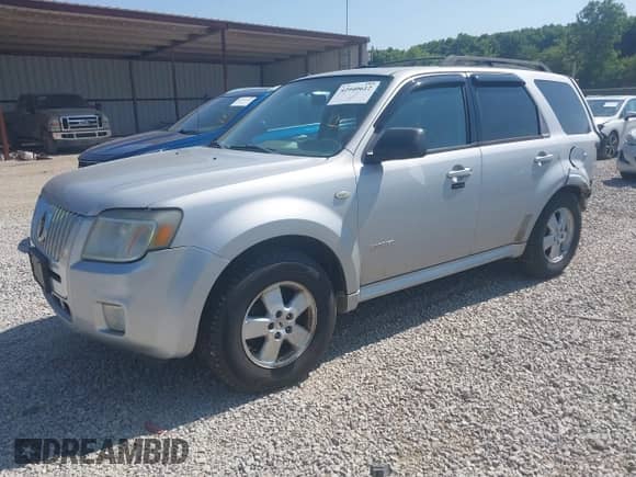 2008 Mercury Mariner with VIN 4M2CU91128KJ12970, listed as a IAAI auction lot 42940612 with 201,682 mi miles and . Bid and sale history available at DreamBid. Image 2.