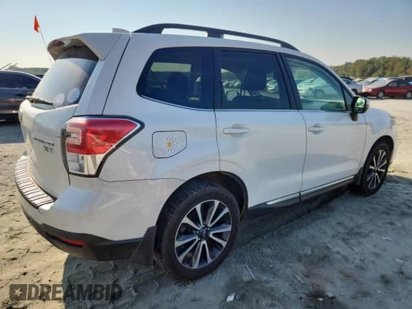 2017 Subaru Forester Touring z VIN JF2SJGWCXHH542608, wystawiony jako Copart lot #80816115 z przebiegiem 147 233 mil mil oraz Szkoda całkowita • Salvage title. Historia ofert i sprzedaży dostępna na DreamBid. Obrazek 3.