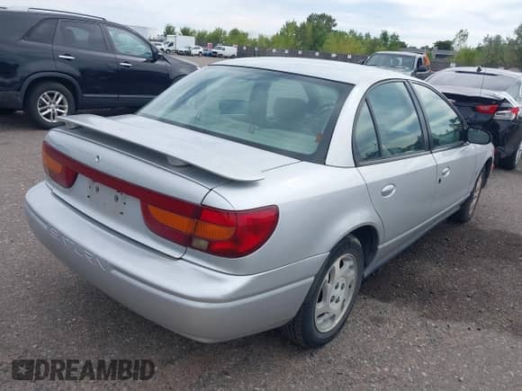 2002 Saturn SL с VIN 1G8ZK52712Z234973, выставлен на аукционе IAAI как лот 43263075 с пробегом 153 198 миль миль и . История ставок и продаж доступна на DreamBid. Изображение 4.