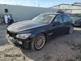 2013 BMW 7 Series 750i xDrive with VIN WBAYB6C50DD223786, listed as a Copart auction lot 87579345 with 143,523 mi miles and Salvage title. Bid and sale history available at DreamBid. Image 1.