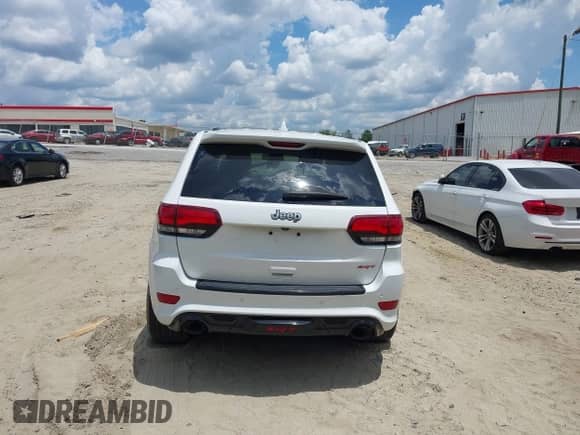 2014 Jeep Grand Cherokee SRT-8 z VIN 1C4RJFDJXEC450402, wystawiony jako IAAI lot #42705334 z przebiegiem 67 372 mil mil oraz . Historia ofert i sprzedaży dostępna na DreamBid. Obrazek 16.