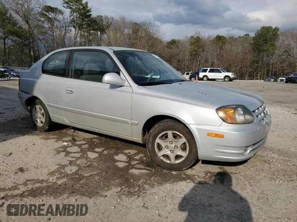2003 Hyundai Accent GL с VIN KMHCG35CX3U270374, выставлен на аукционе Copart как лот 47240325 с пробегом 122 739 миль миль и Списание • Salvage title. История ставок и продаж доступна на DreamBid. Изображение 4.