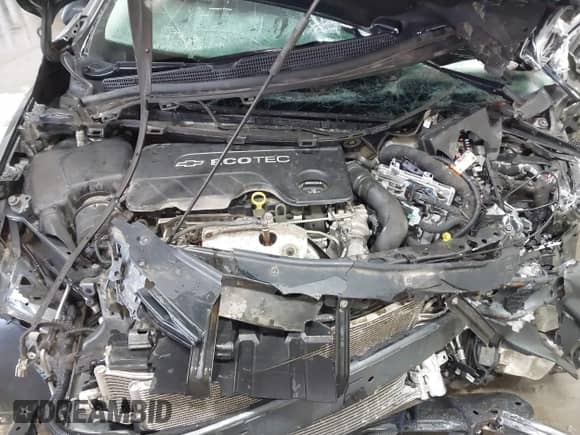 2018 Chevrolet Cruze LT z VIN 3G1BH6SE9JS655290, wystawiony jako IAAI lot #41538717 z przebiegiem Nie podano mil oraz . Historia ofert i sprzedaży dostępna na DreamBid. Obrazek 10.