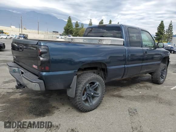 1999 GMC Sierra 1500 SL with VIN 1GTEK19TXXE506578, listed as a Copart auction lot 85857155 with 180,128 mi miles and Salvage title. Bid and sale history available at DreamBid. Image 3.