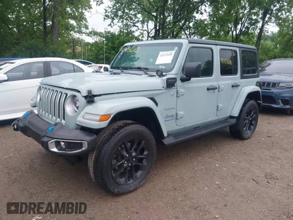 2023 Jeep Wrangler Sahara with VIN 1C4JJXP67PW604835, listed as a IAAI auction lot 42431648 with 15,209 mi miles and . Bid and sale history available at DreamBid. Image 2.