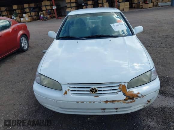 1997 Toyota Camry LE z VIN 4T1BF22K5VU922079, wystawiony jako IAAI lot #43326104 z przebiegiem Nie podano mil oraz . Historia ofert i sprzedaży dostępna na DreamBid. Obrazek 6.